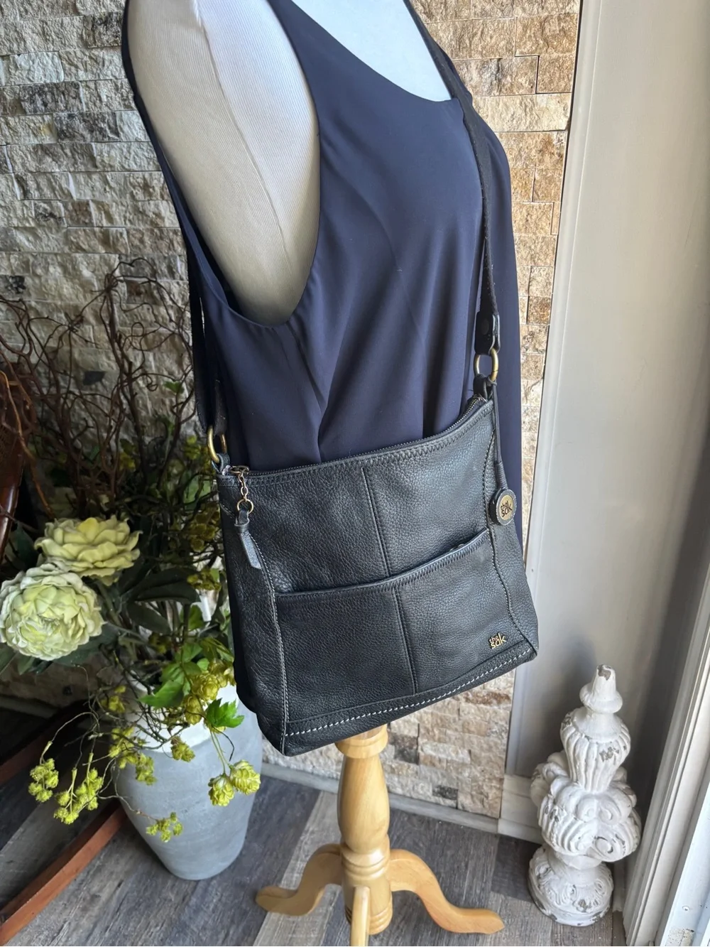 The Sak Black Leather Pebbled Crossbody with Gold Accents